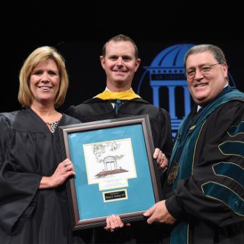 From left: Director of Alumni Relations Jean Ann Brakefield '84, Alumnus of the Year Brian Forbus '97 and CCU President David A. DeCenzo at the 2015 Founders Day Convocation