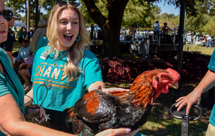Student with Maddox the CCU mascot rooster