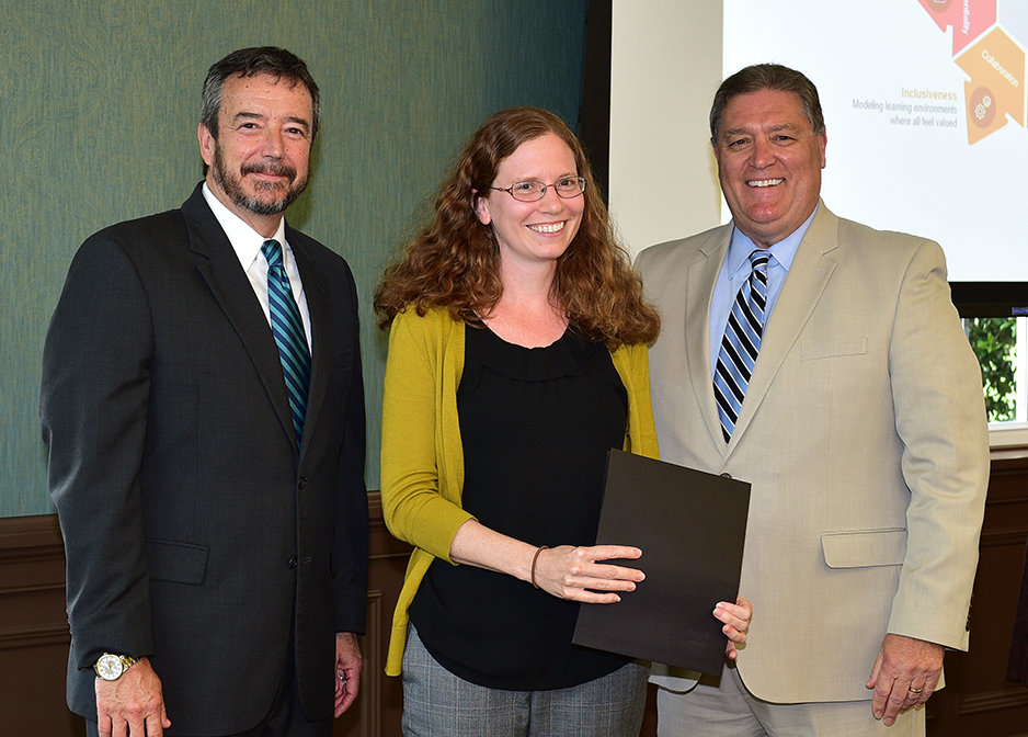 Ariana Baker receives her certificate from Dr. DeCenzo and Dr. Byington