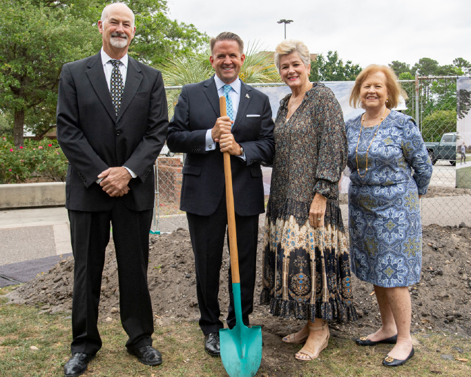 President Michael T. Benson (with shovel) is flanked by Phil and Pat Thompson along with Linda Gagni at the Thompson Library groundbreaking ceremony. Phil is the nephew of the late John and Barbara Thompson, for whom the library is named. 