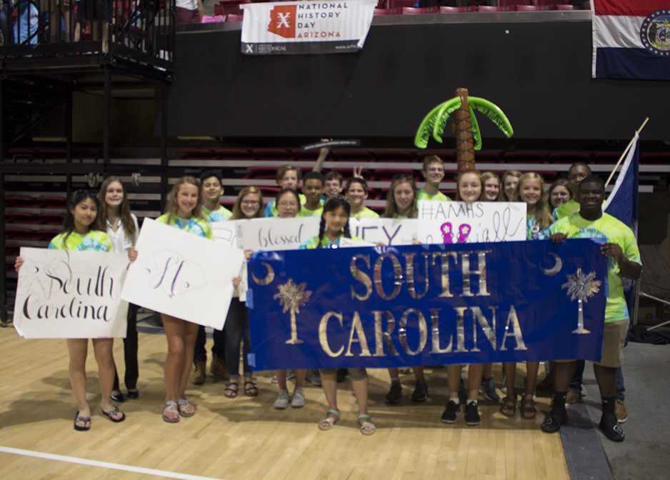 Group photograph of students with 2018 banner