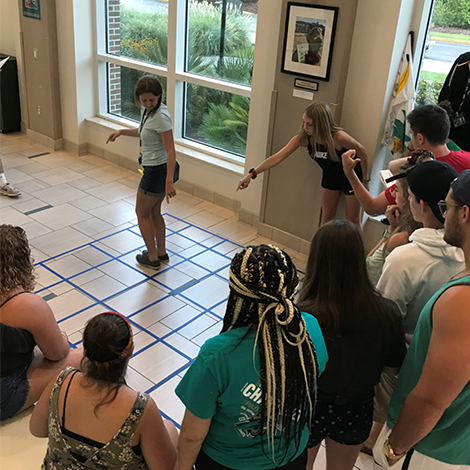 Students working through giant maze image