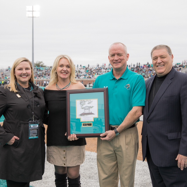 Left to right: CCU Executive Director of Alumni Relations Julie Cheney; Stacy Henderson; CCU Outstanding Alumnus of the Year D. Wyatt Henderson; and CCU President David A. DeCenzo