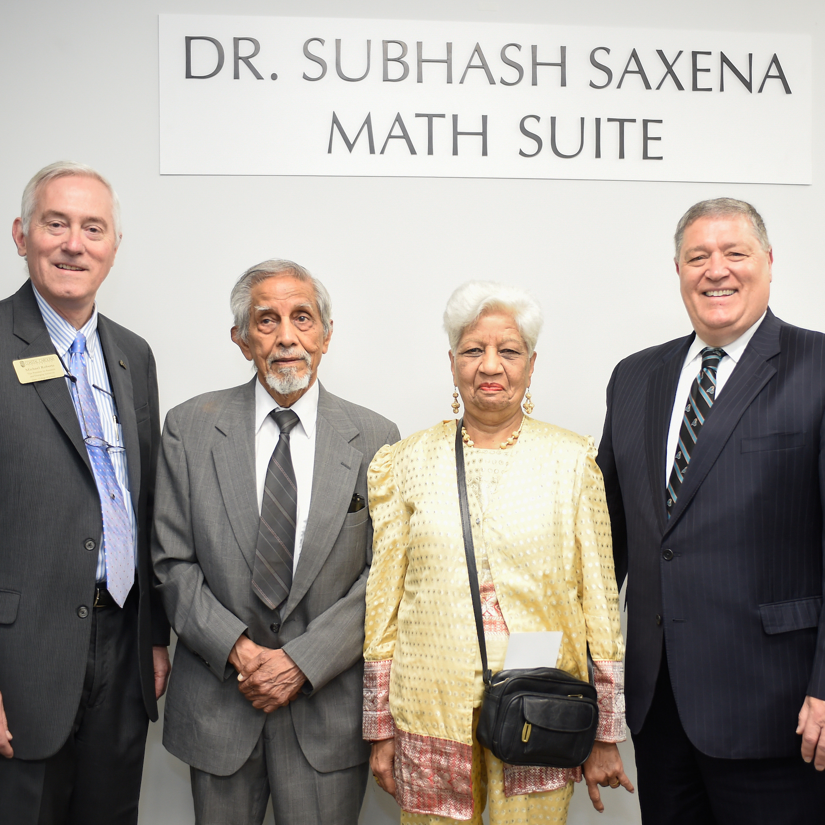 Michael Roberts, dean of the College of Science (from left); Dr. Subhash Saxena; his wife Pushpa Saxena; and David A. DeCenzo, president of CCU.