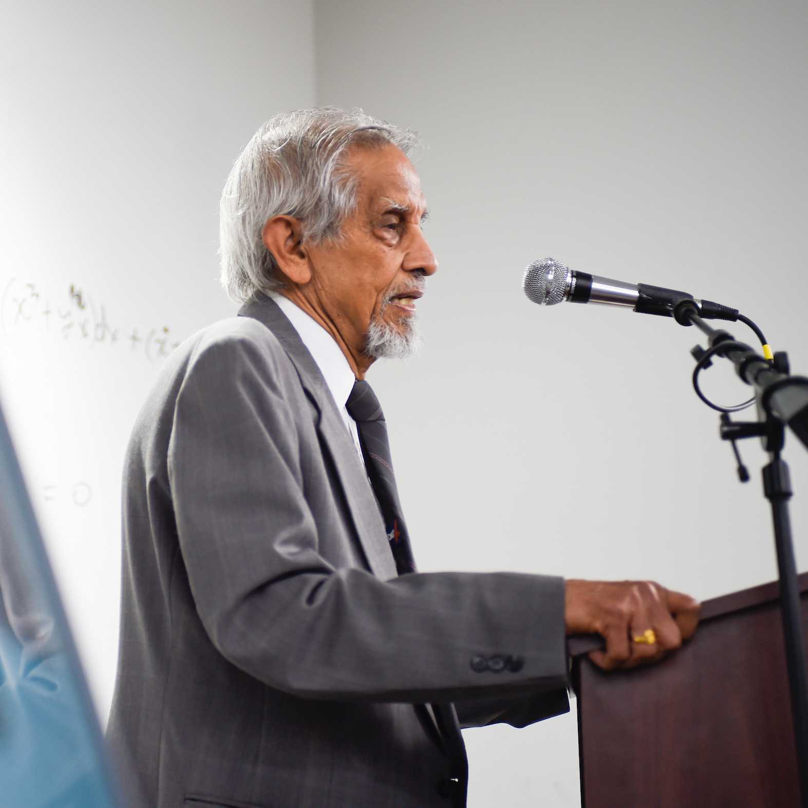 Dr. Subhash Saxena, distinguished professor emeritus, speaks at the dedication of the Dr. Subhash Saxena Math Suite on April 26.