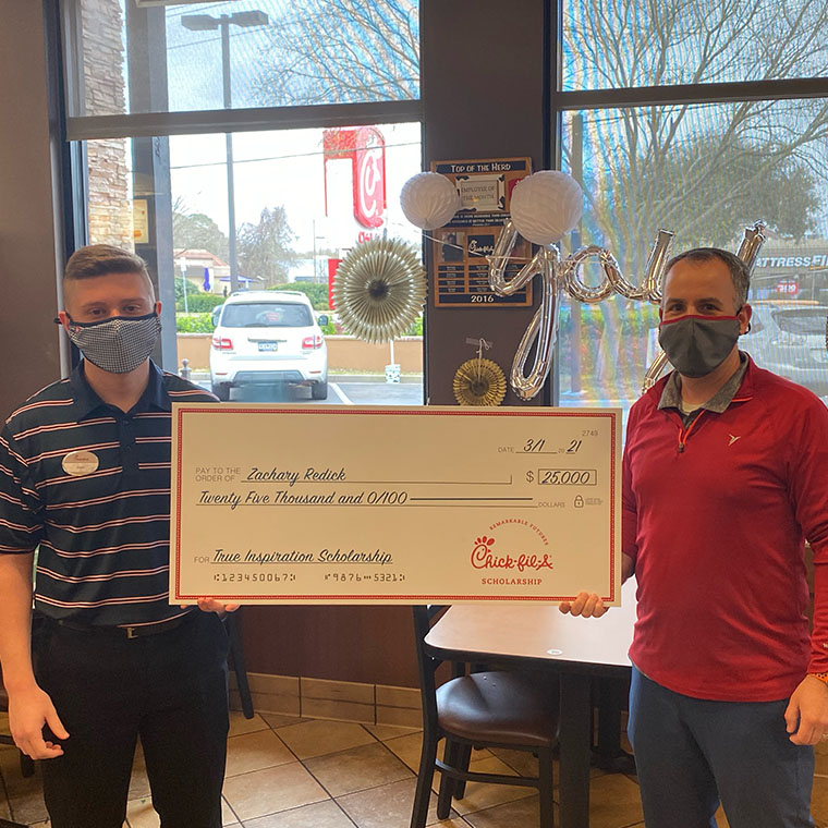 CCU student Zachary Redick (left) was presented a Chick-fil-A $25,000 True Inspiration Scholarship by Jason Williams, owner of Chick-fil-A James Island in Charleston, S.C.