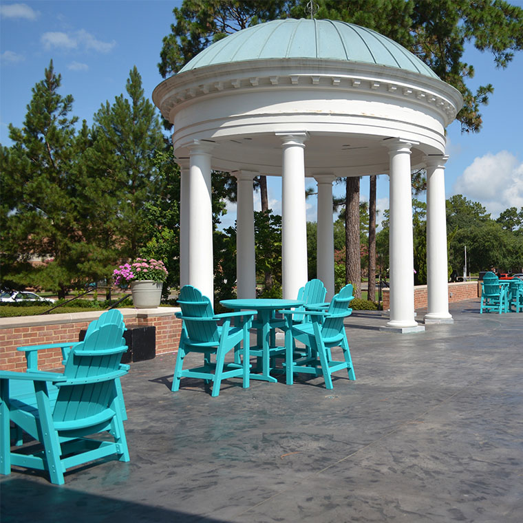 The Pi Kappa Phi Patio is located outside the Clark and Marcia Parker Atheneum Hall Alumni Center.