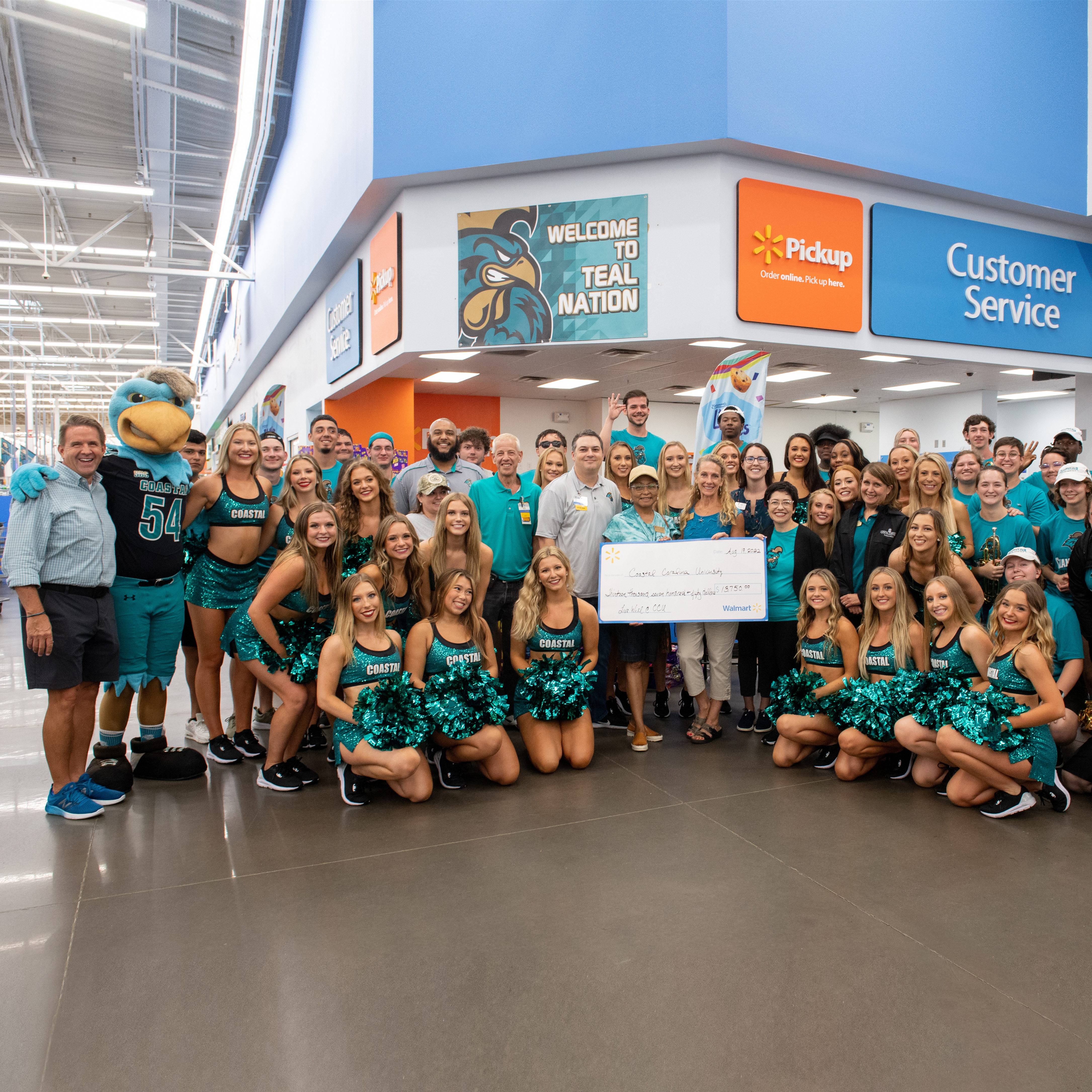 Coastal Carolina University received a $13,750 donation from Myrtle Beach area Walmart stores during its annual back to school pep rally event at Walmart on Myrtle Ridge Drive in Conway.