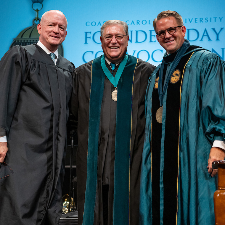 President Emeritus David A. DeCenzo is flanked by Wyatt Henderson, former CCU board chairman (left), and President Michael T. Benson.