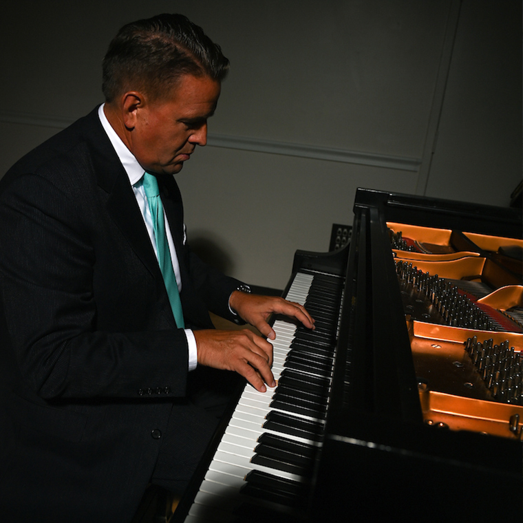 CCU President Michael T. Benson was taught to play the piano by his mother, Lela, and is a strong supporter of the arts.