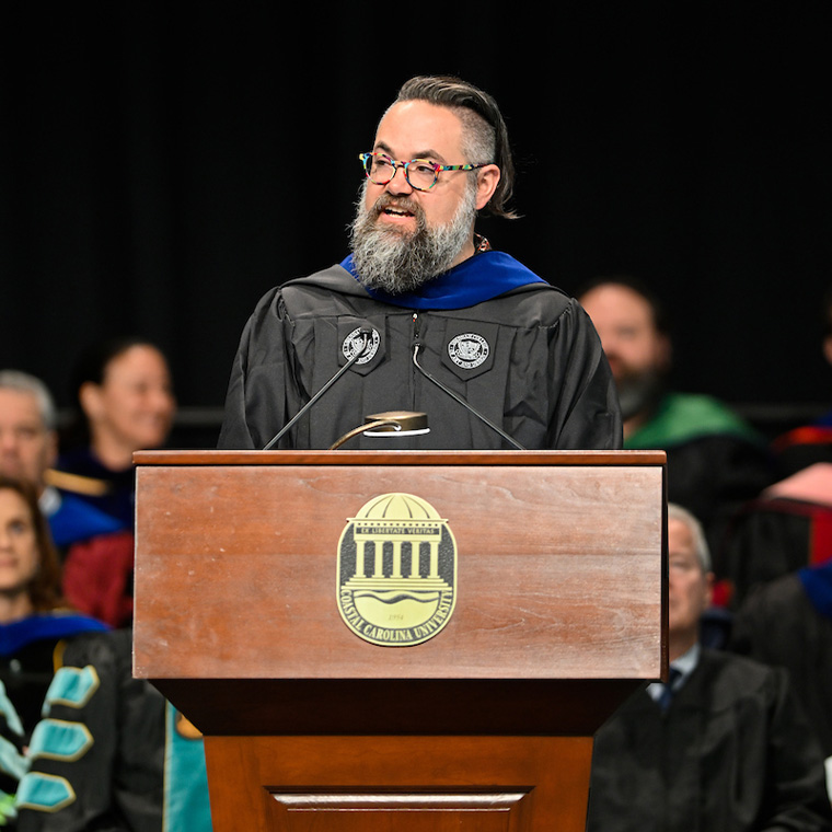 Charles Clary, recipient of CCU’s 2022 HTC Distinguished Teacher-Scholar Lecturer Award and associate professor of visual arts, delivered the commencement address.