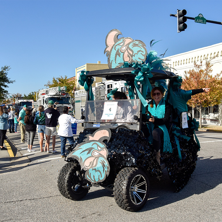 Members of the campus and Conway communities join together to share their pride for Teal Nation during the downtown Conway parade.