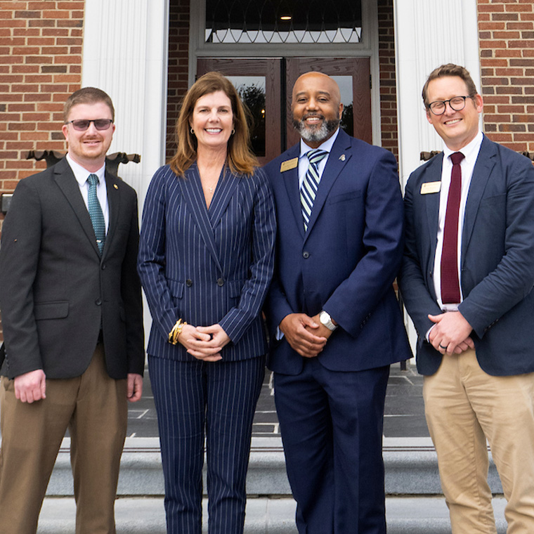 Evette with CCU College of Graduate and Continuing Studies administrators Matthew Tyler, J. Lee Brown, and Casey Woodling